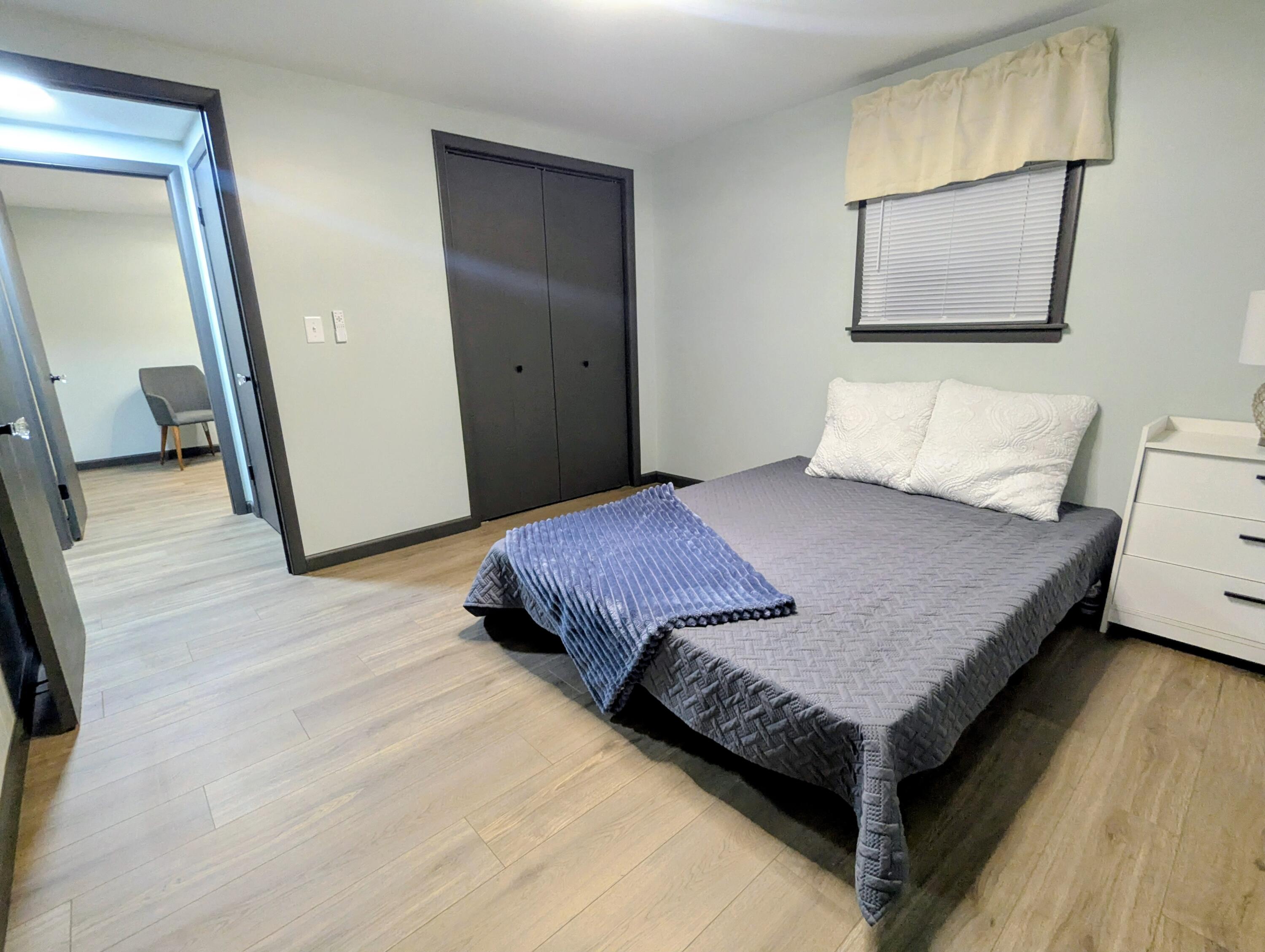 521 Ryan Road Hebron, IN 46341 - Photo 14 of 25 a bedroom with a bed and wooden floor