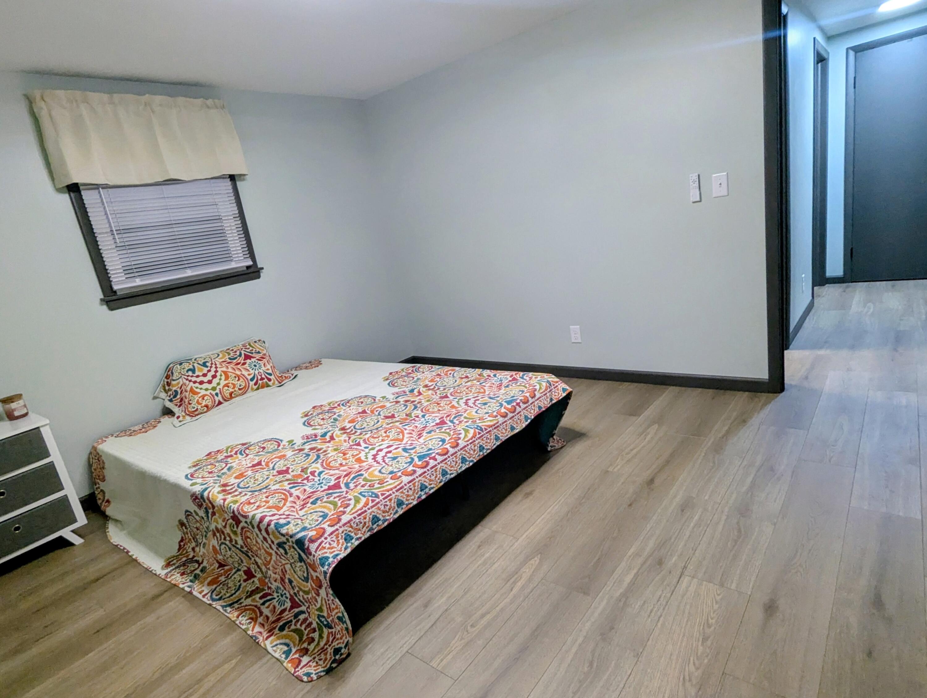 521 Ryan Road Hebron, IN 46341 - Photo 16 of 25 a bedroom with a bed and wooden floor