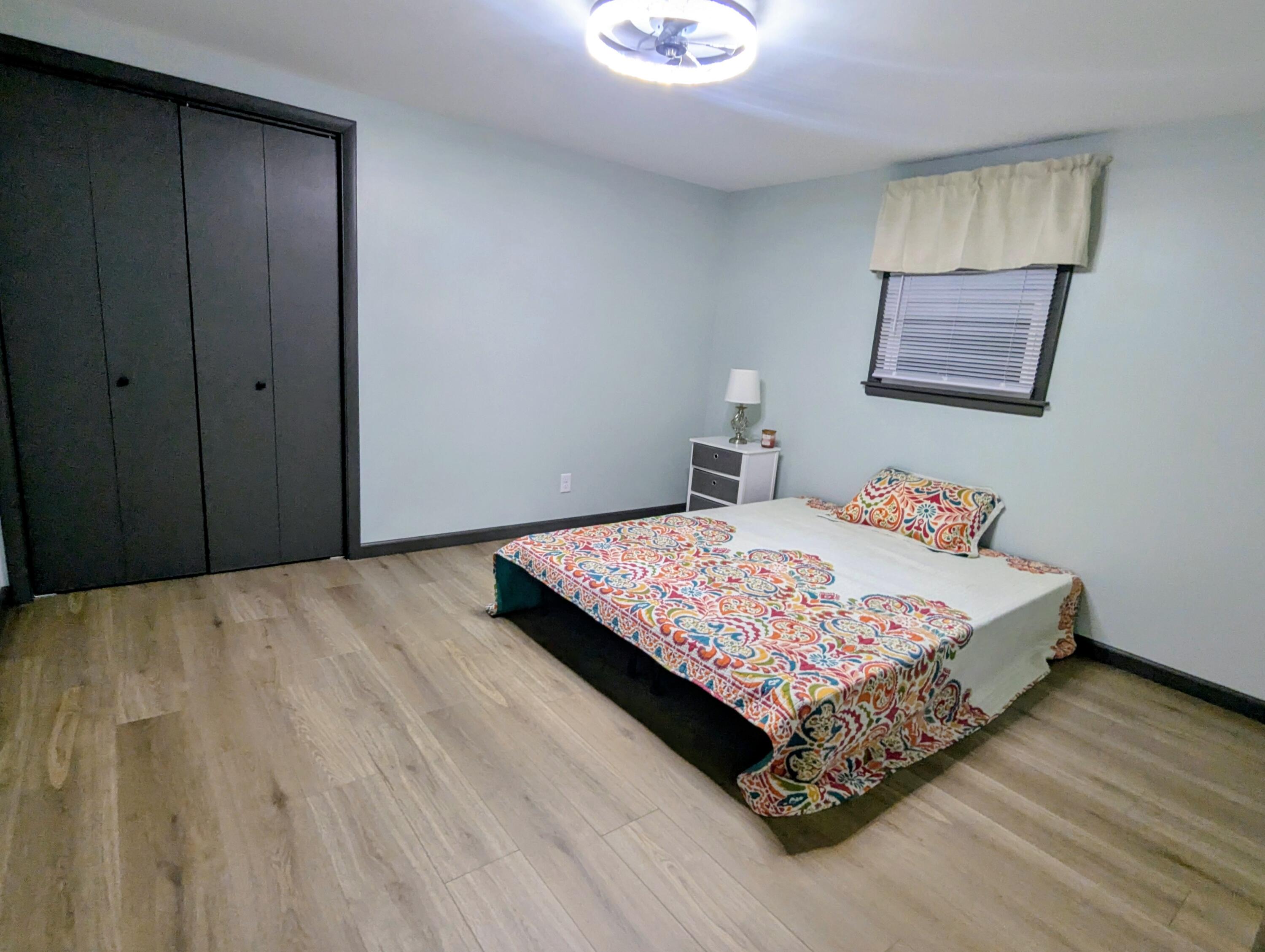 521 Ryan Road Hebron, IN 46341 - Photo 17 of 25 a bedroom with a bed and wooden floor