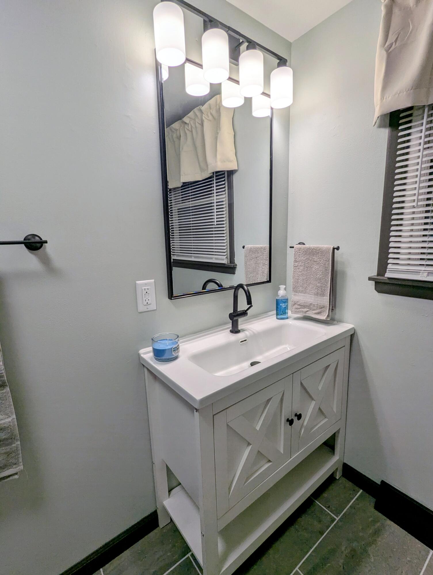 521 Ryan Road Hebron, IN 46341 - Photo 20 of 25 a bathroom with a sink and a mirror
