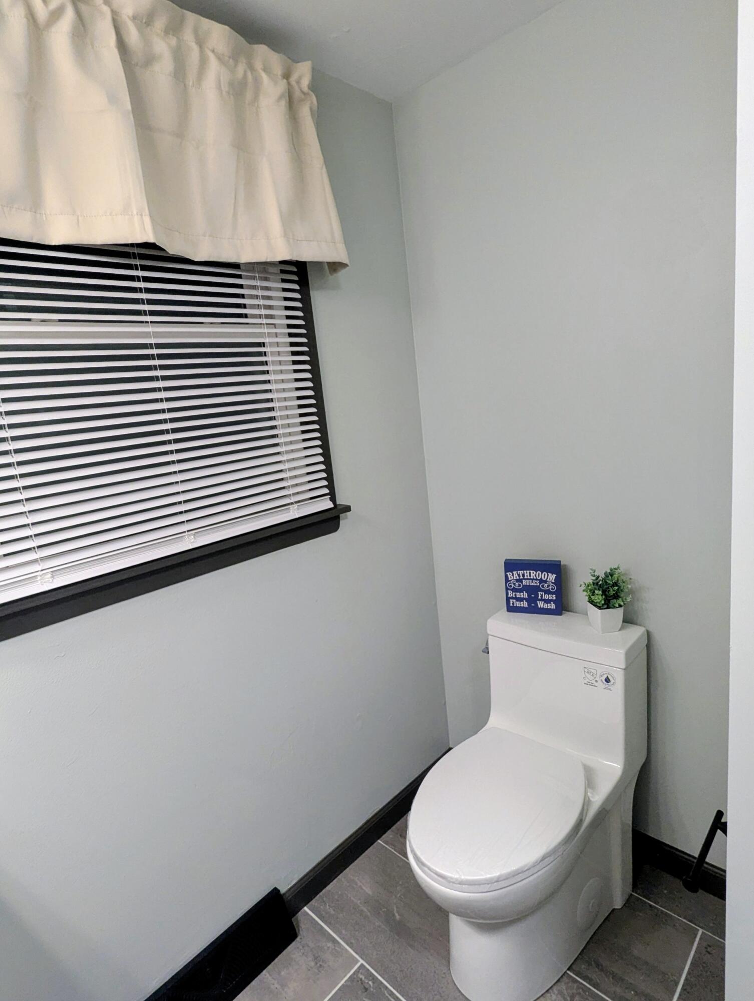 521 Ryan Road Hebron, IN 46341 - Photo 21 of 25 a white toilet sitting next to a white sink