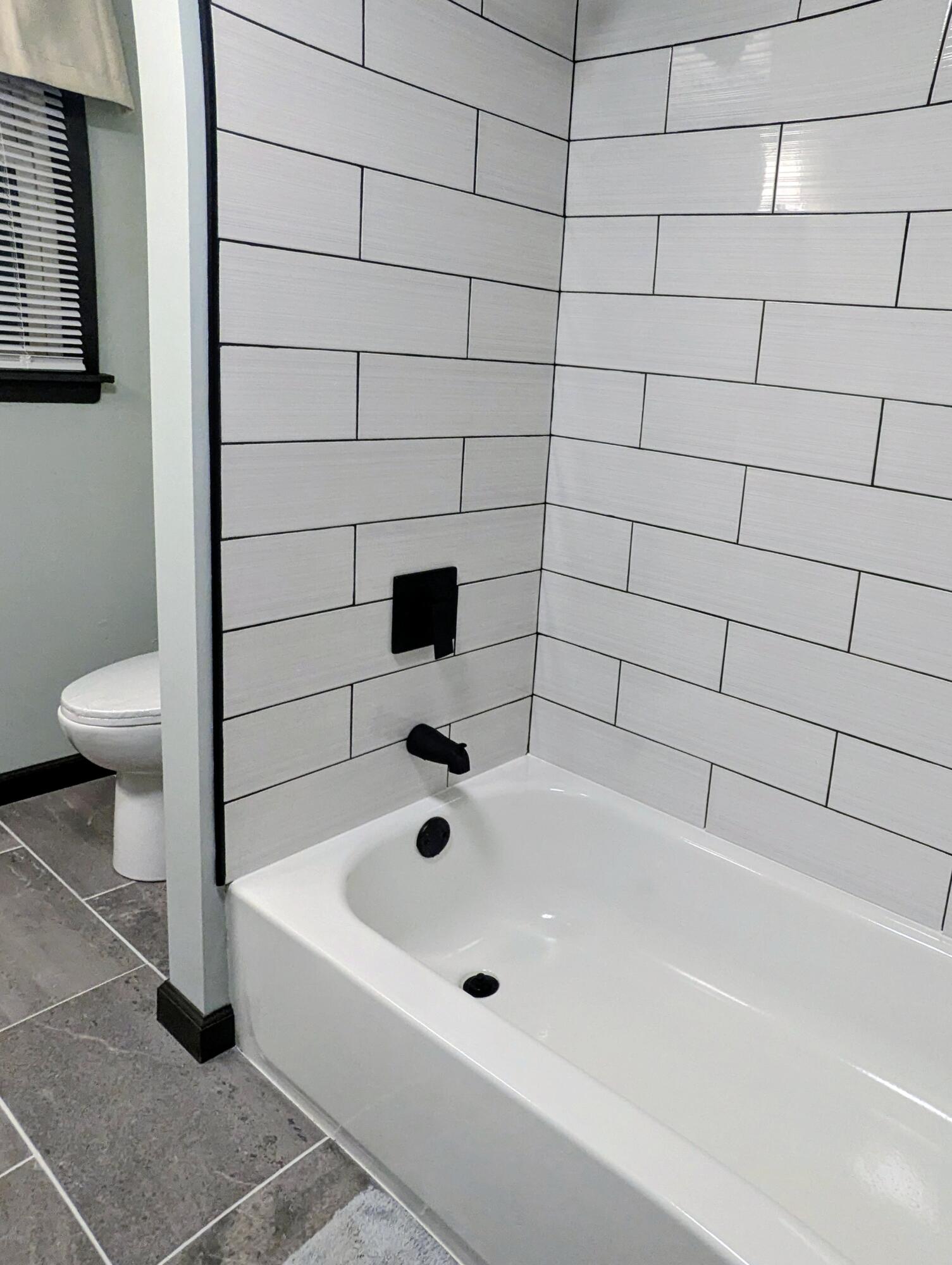 521 Ryan Road Hebron, IN 46341 - Photo 22 of 25 a bathroom with a bathtub and toilet