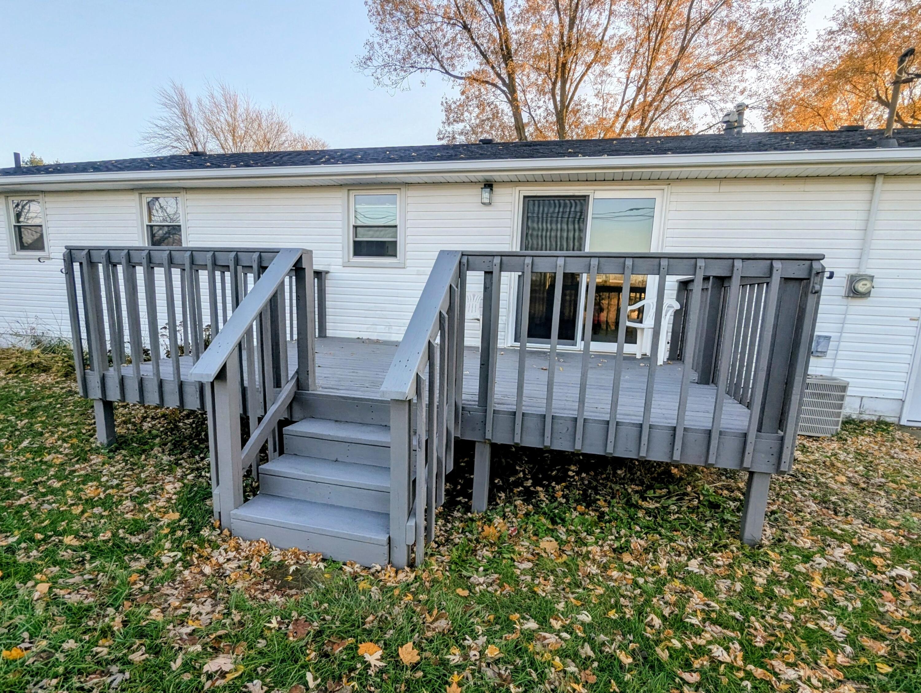 521 Ryan Road Hebron, IN 46341 - Photo 23 of 25 a view of a house with wooden deck front of house