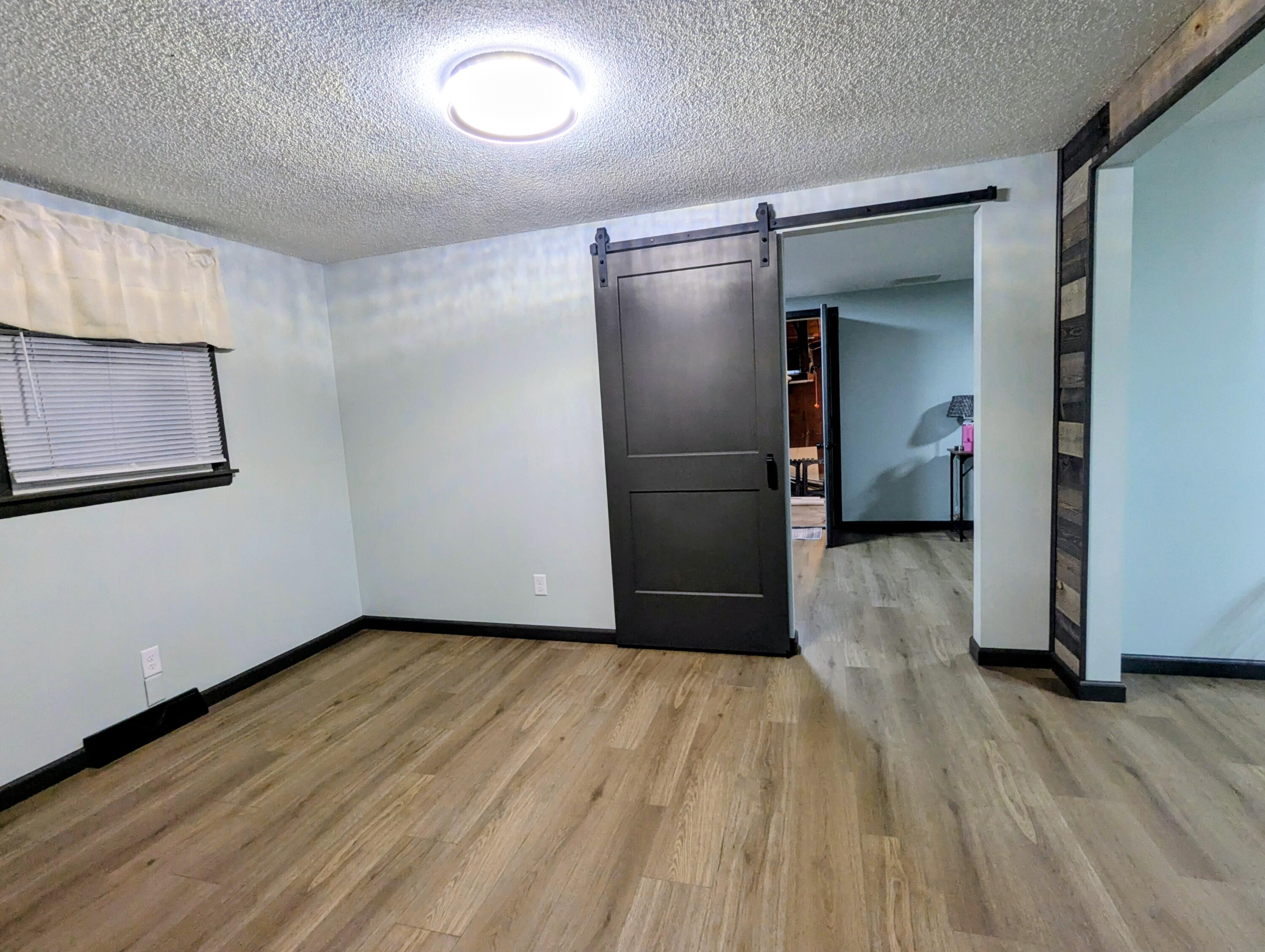 521 Ryan Road Hebron, IN 46341 - Photo 5 of 25 a view of empty room with wooden floor and closet