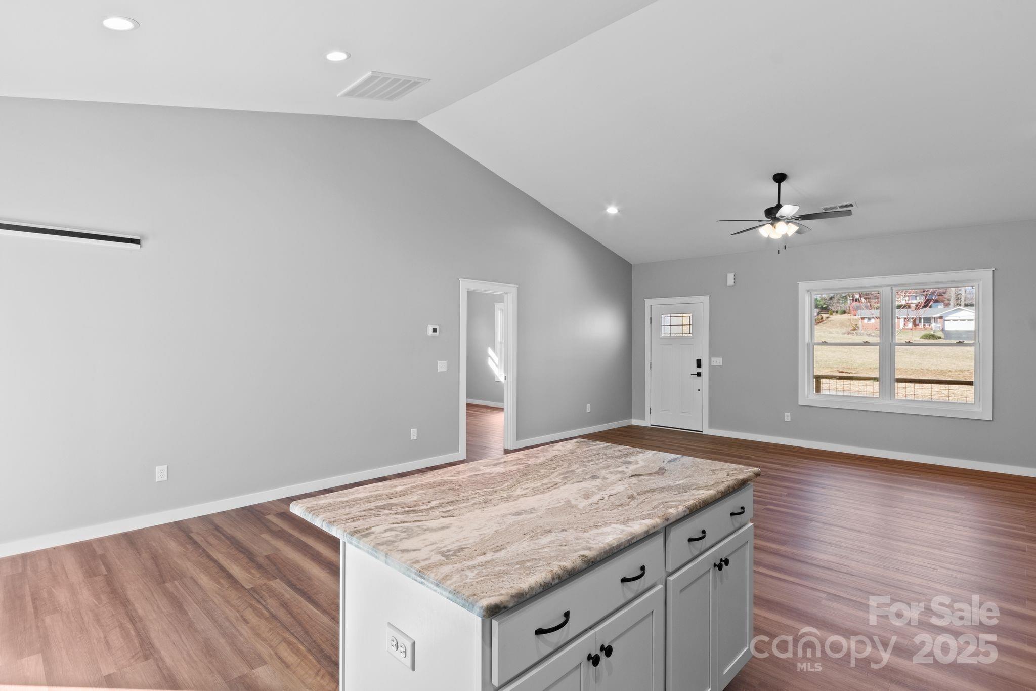 80 Peyton Elaine Road Clyde, NC 28721 - Photo 11 of 28 a view of a kitchen with a sink and wooden floor
