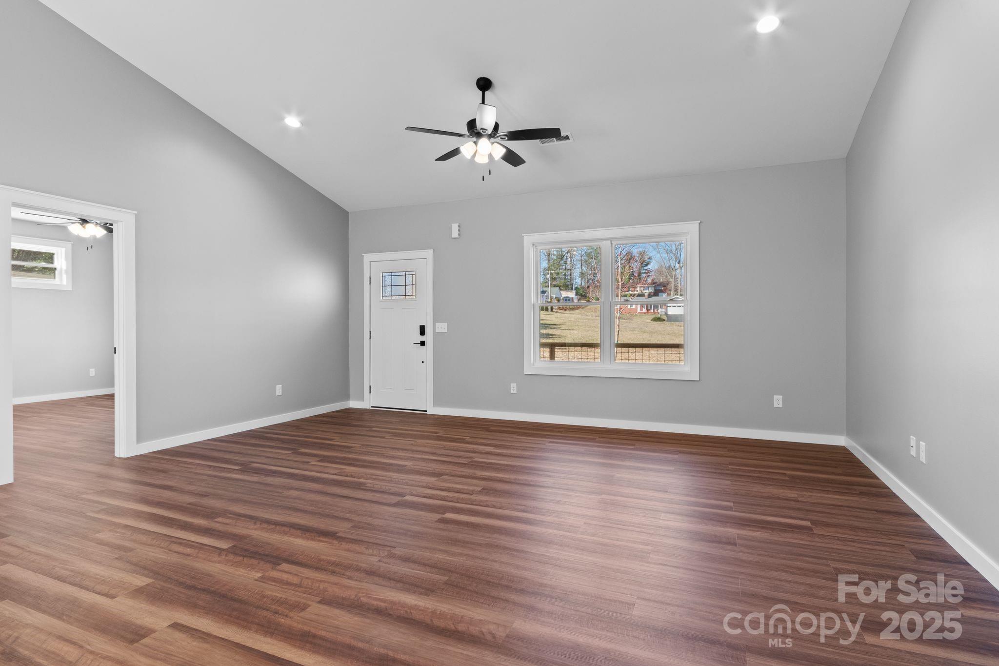 80 Peyton Elaine Road Clyde, NC 28721 - Photo 12 of 28 wooden floor in an empty room with a window