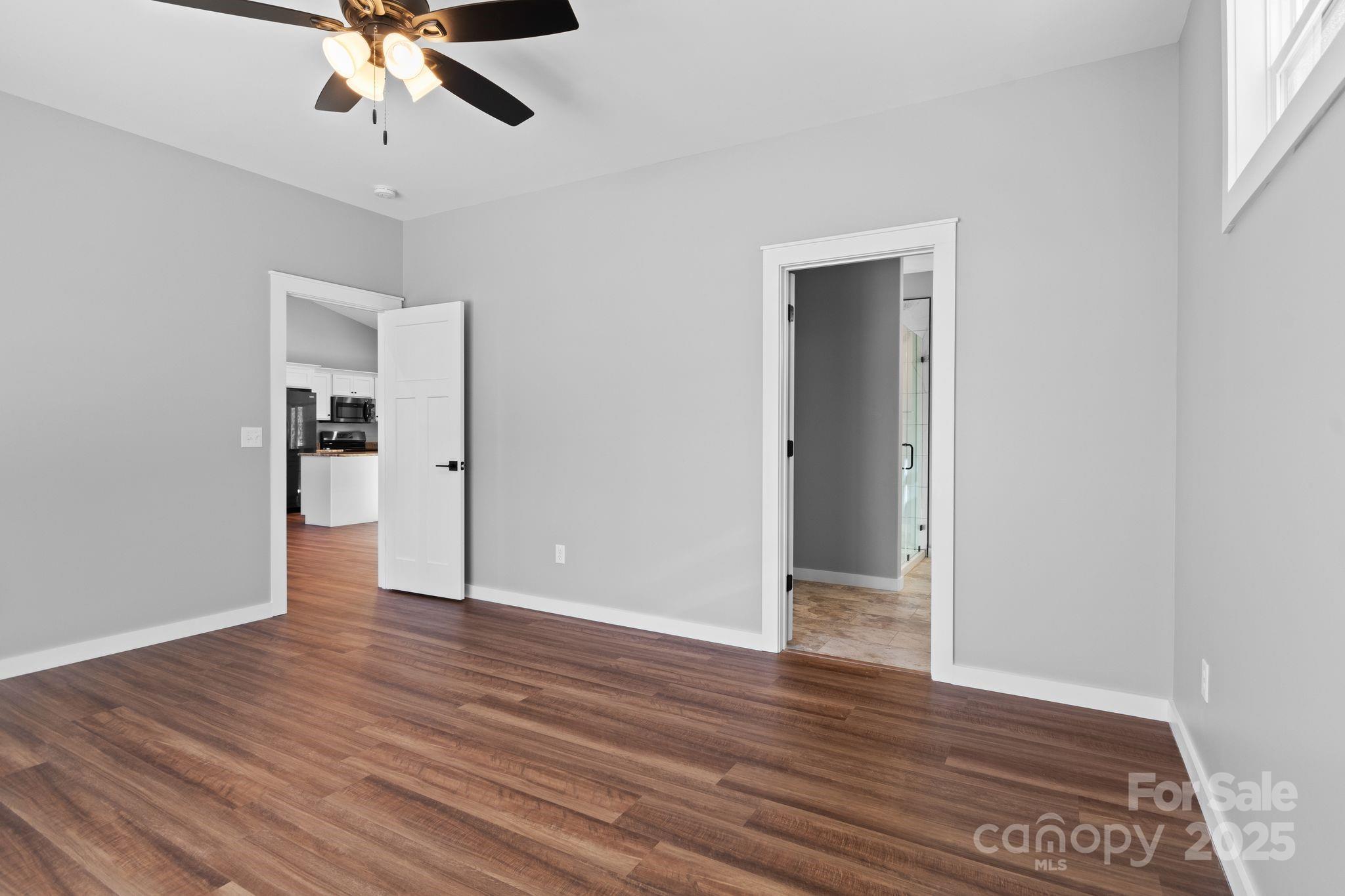80 Peyton Elaine Road Clyde, NC 28721 - Photo 15 of 28 a view of an empty room with wooden floor