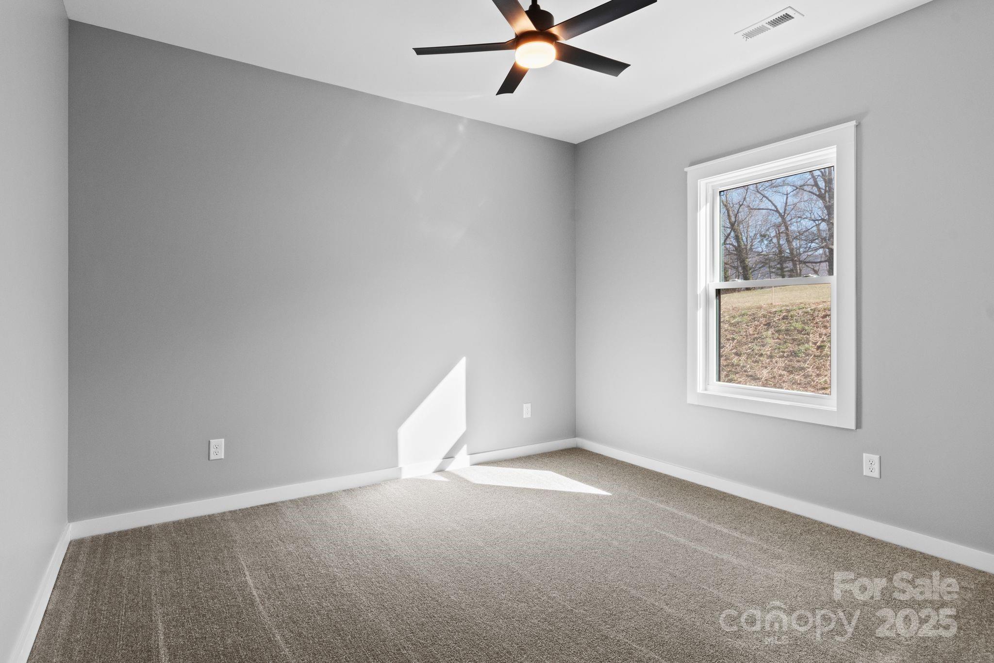 80 Peyton Elaine Road Clyde, NC 28721 - Photo 20 of 28 a view of an empty room with a window
