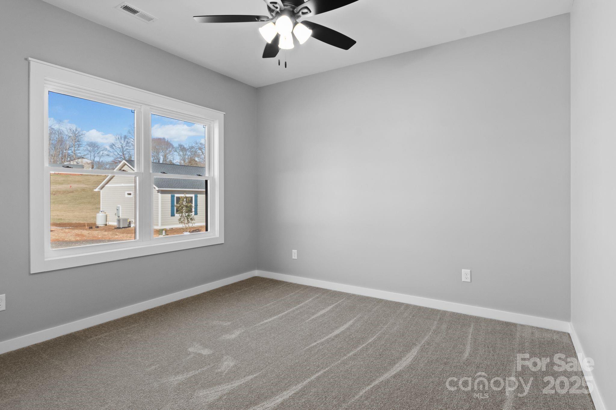 80 Peyton Elaine Road Clyde, NC 28721 - Photo 23 of 28 an empty room with a window