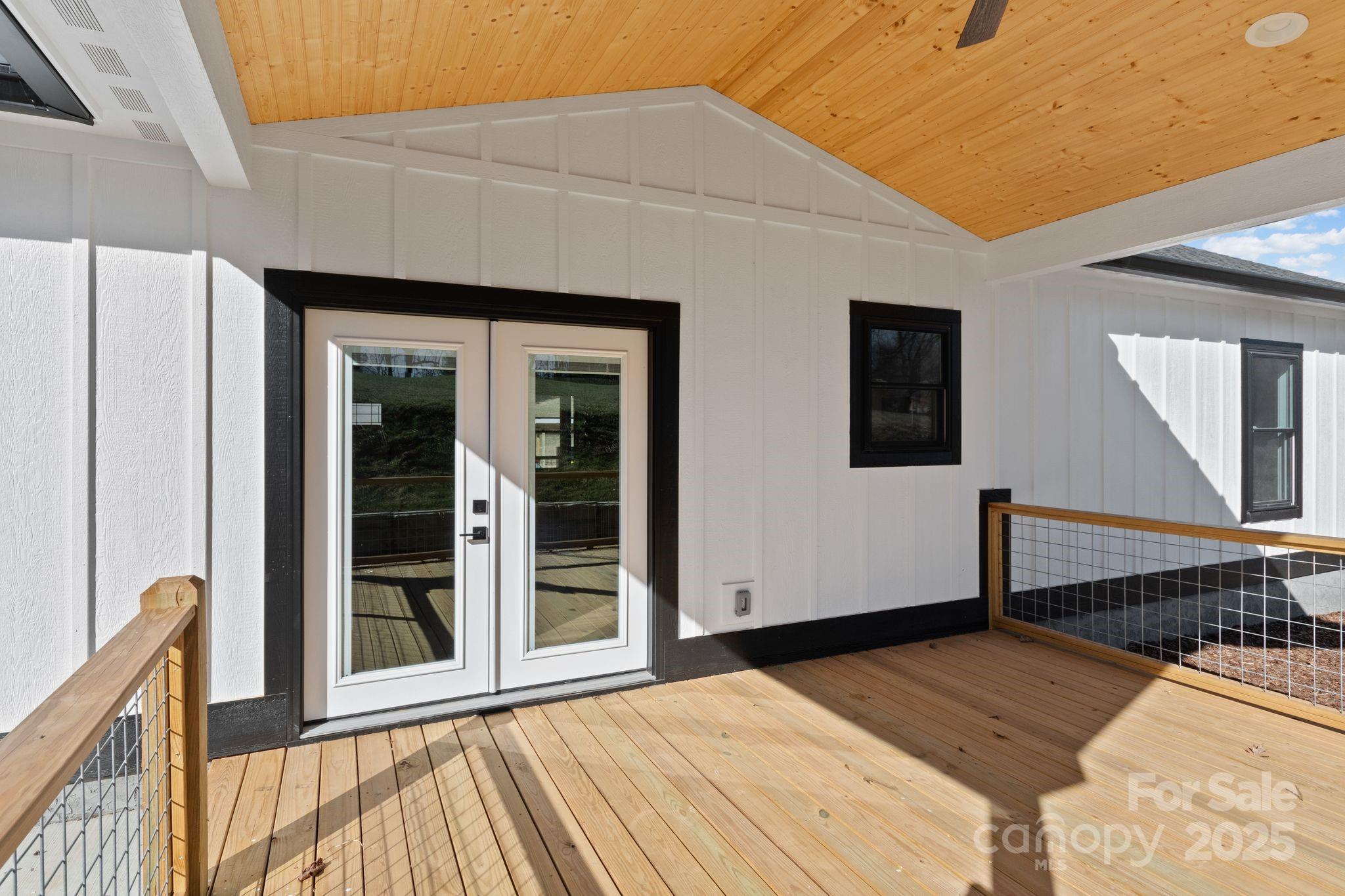 80 Peyton Elaine Road Clyde, NC 28721 - Photo 25 of 28 a view of a house with wooden floor and a barbeque