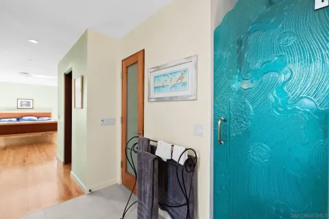 a bedroom with furniture and a large window