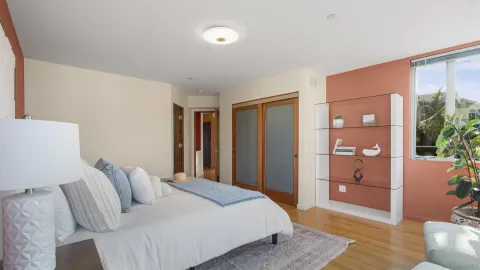 a bedroom with a bed and window