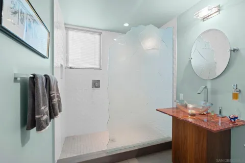 a bedroom with a bed and a chair