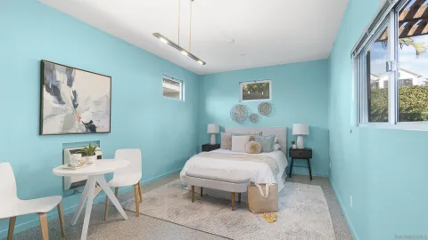 a bedroom with a bed and a table