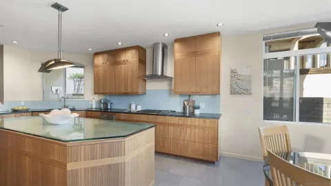 a kitchen with a sink cabinets and window