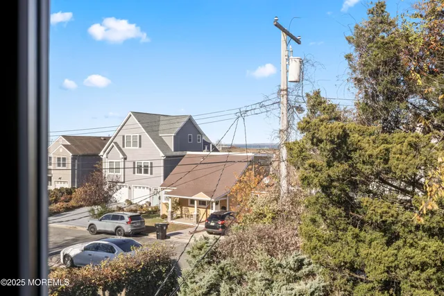 a view of a patio with table and chairs with wooden floor and fence