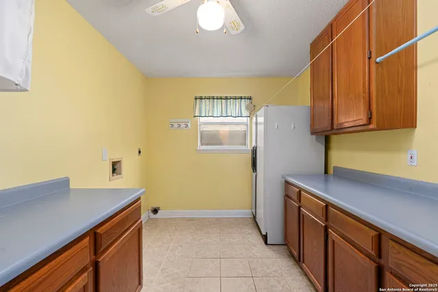 a kitchen with a sink and a refrigerator