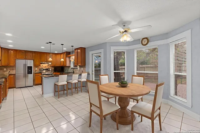 a view of a dining room with furniture window and outside view