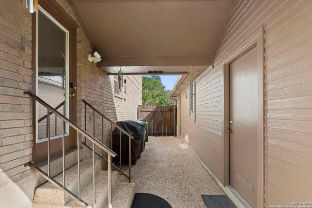 a view of balcony with furniture