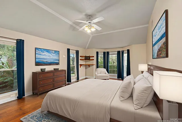 a bedroom with a large bed and a dresser