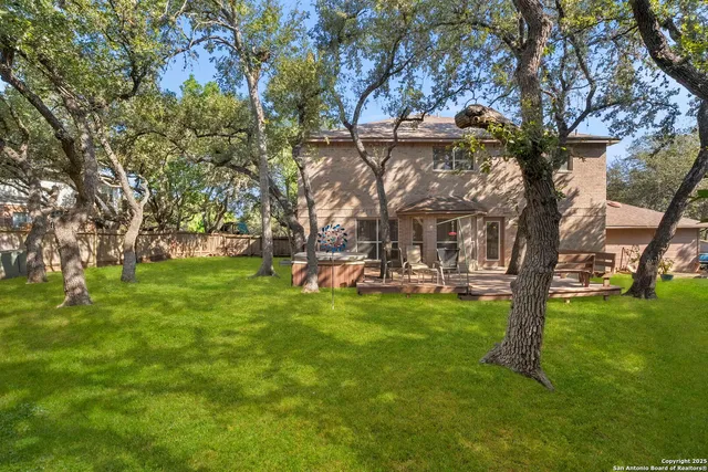 an aerial view of house with yard