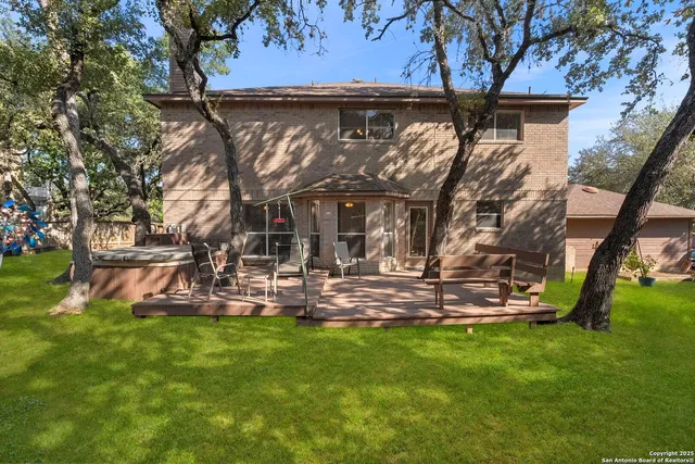 a view of swimming pool with a yard and plants