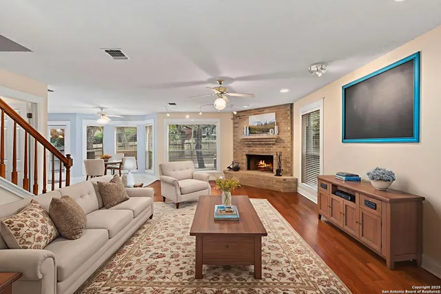 a living room with furniture and a fireplace