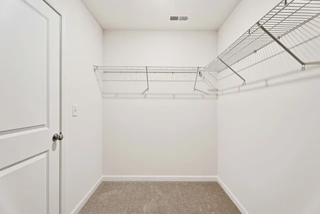 a view of a room with racks on the wall