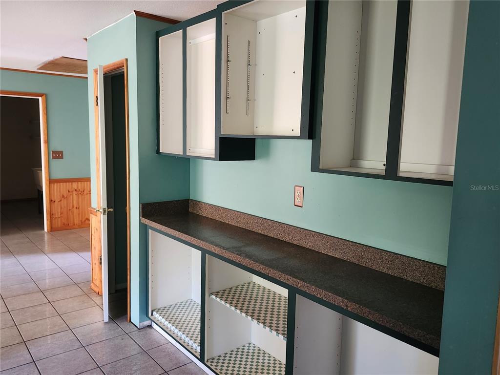 4060 Sail Drive New Port Richey, FL 34652 - Photo 8 of 20 a kitchen with a sink and cabinets