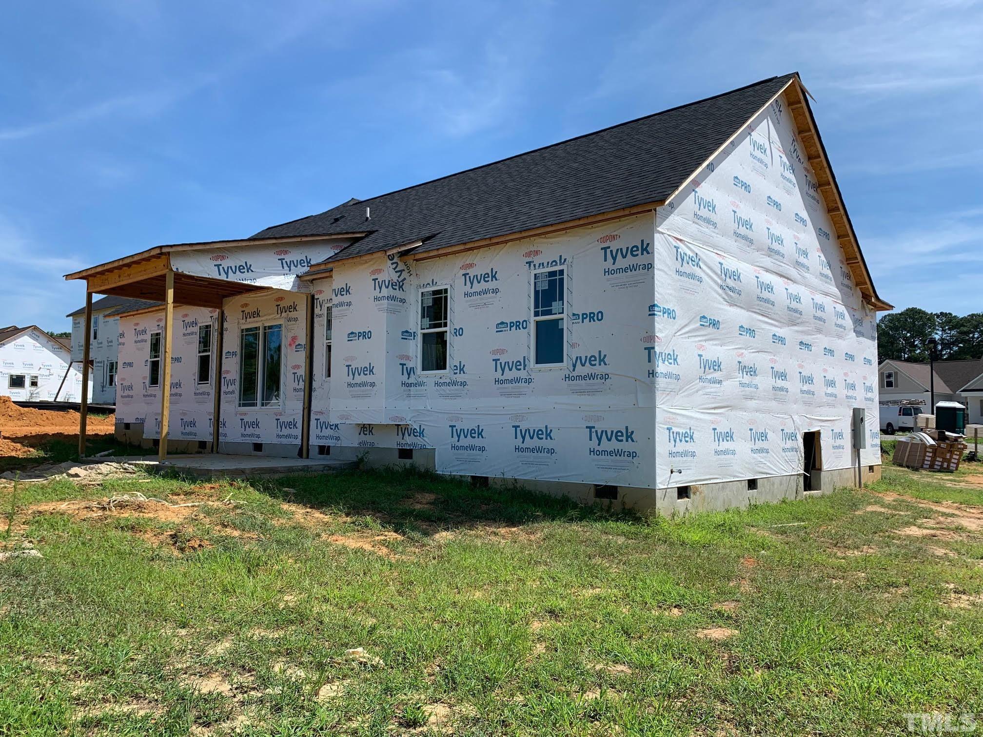 88 Bodacious Lane Benson, NC 27504 - Photo 13 of 13 a view of a house with a yard and sitting area