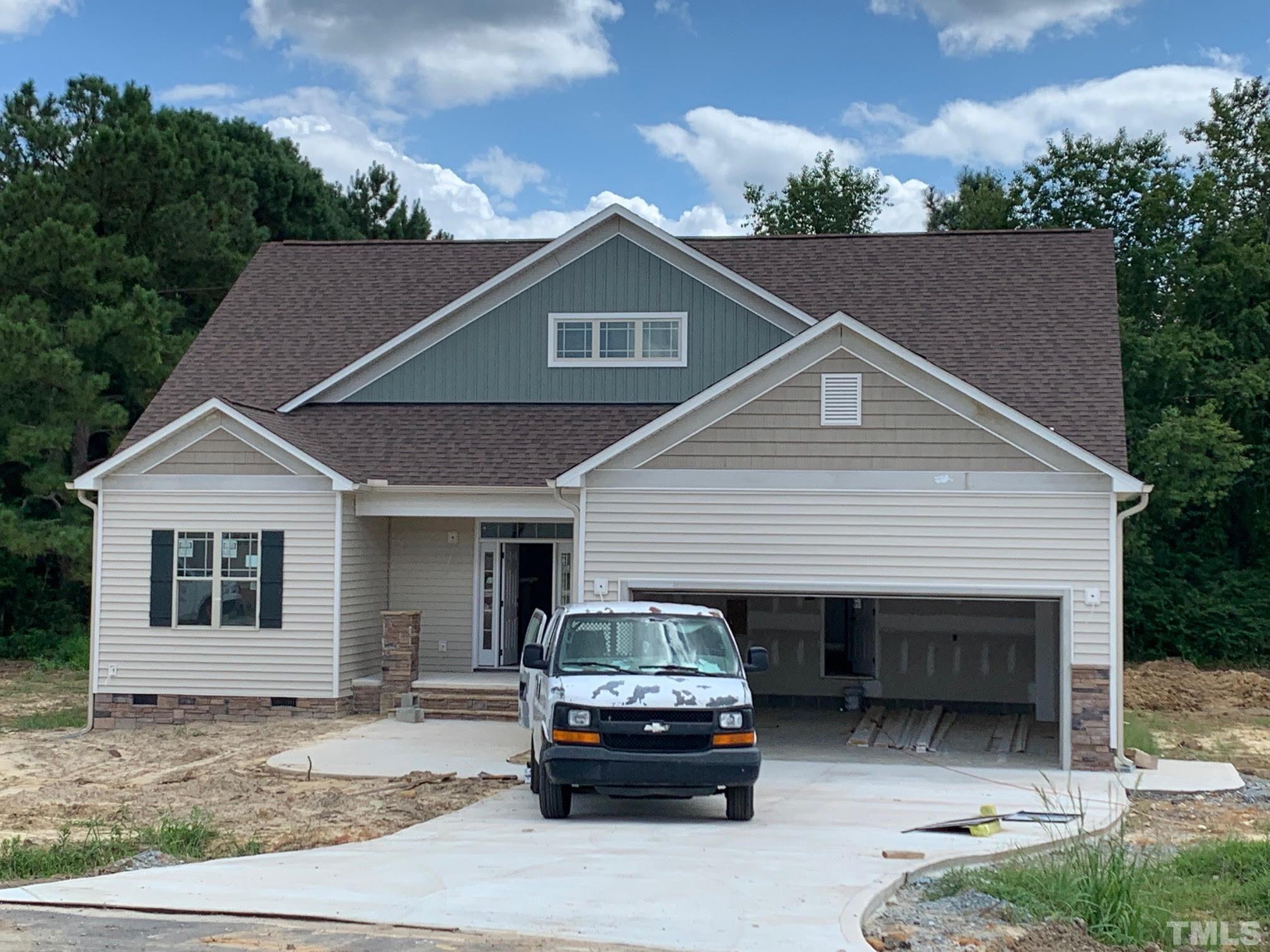 88 Bodacious Lane Benson, NC 27504 - Photo 3 of 13 a car parked in front of white house