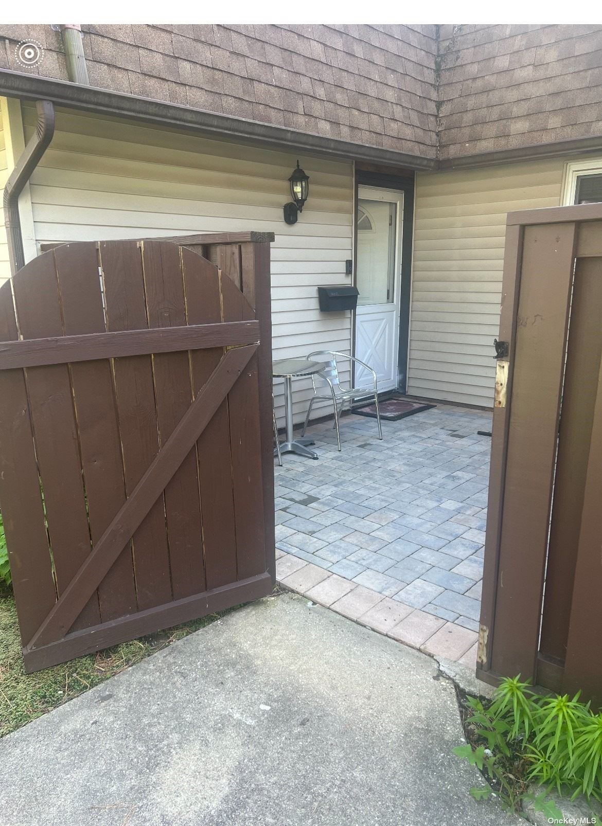 a view of front door and small yard