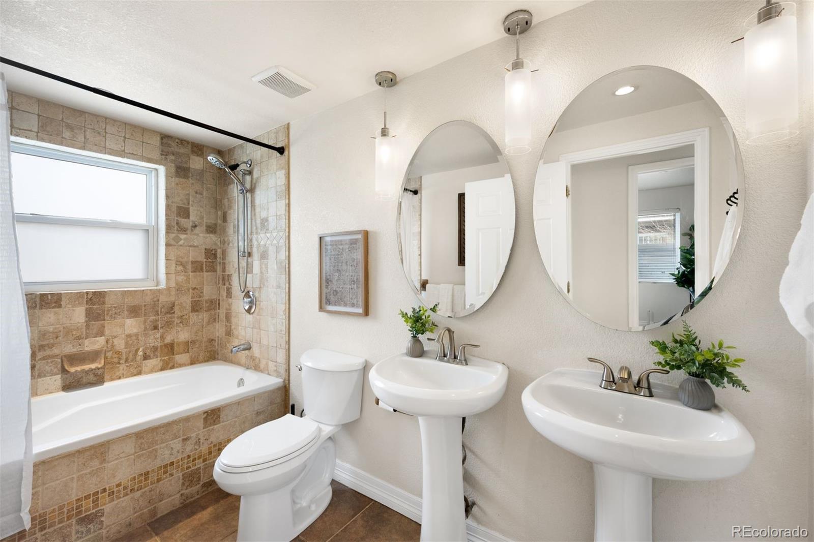 3000 Ivy Street Denver, CO 80207 - Photo 13 of 26 a bathroom with a toilet sink and mirror