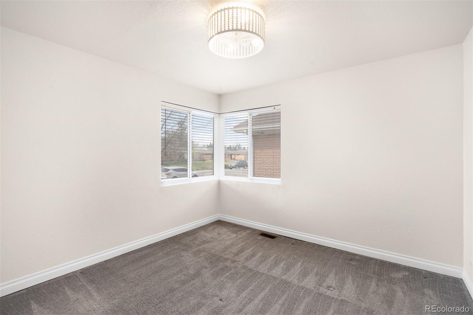 3000 Ivy Street Denver, CO 80207 - Photo 14 of 26 an empty room with a window