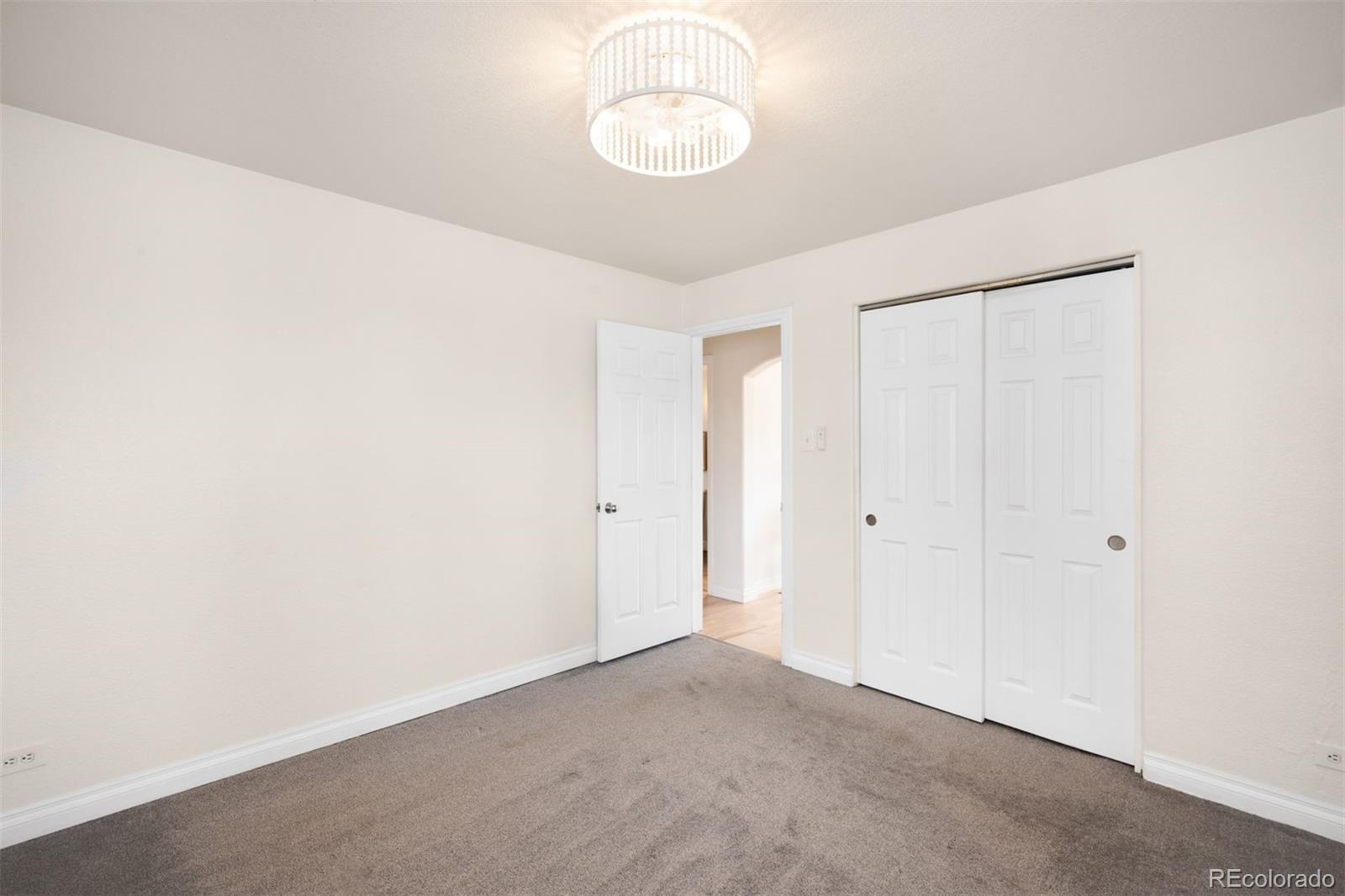 3000 Ivy Street Denver, CO 80207 - Photo 15 of 26 a view of an empty room with a window