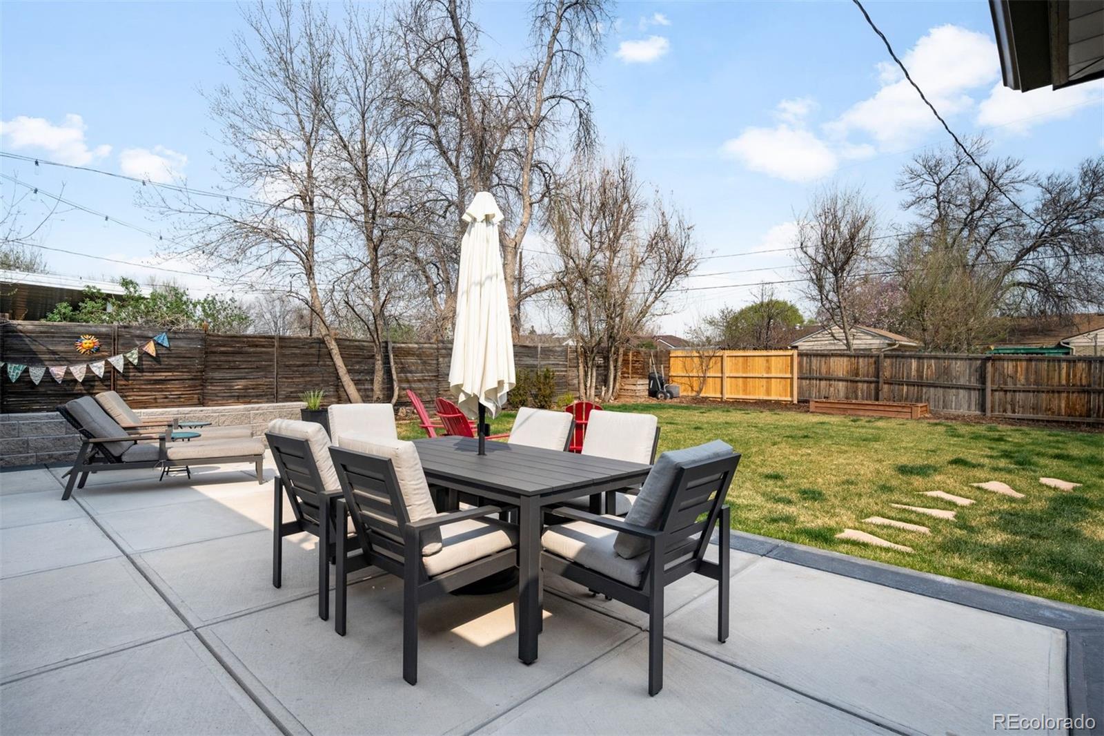 3000 Ivy Street Denver, CO 80207 - Photo 16 of 26 a view of a backyard with sitting area