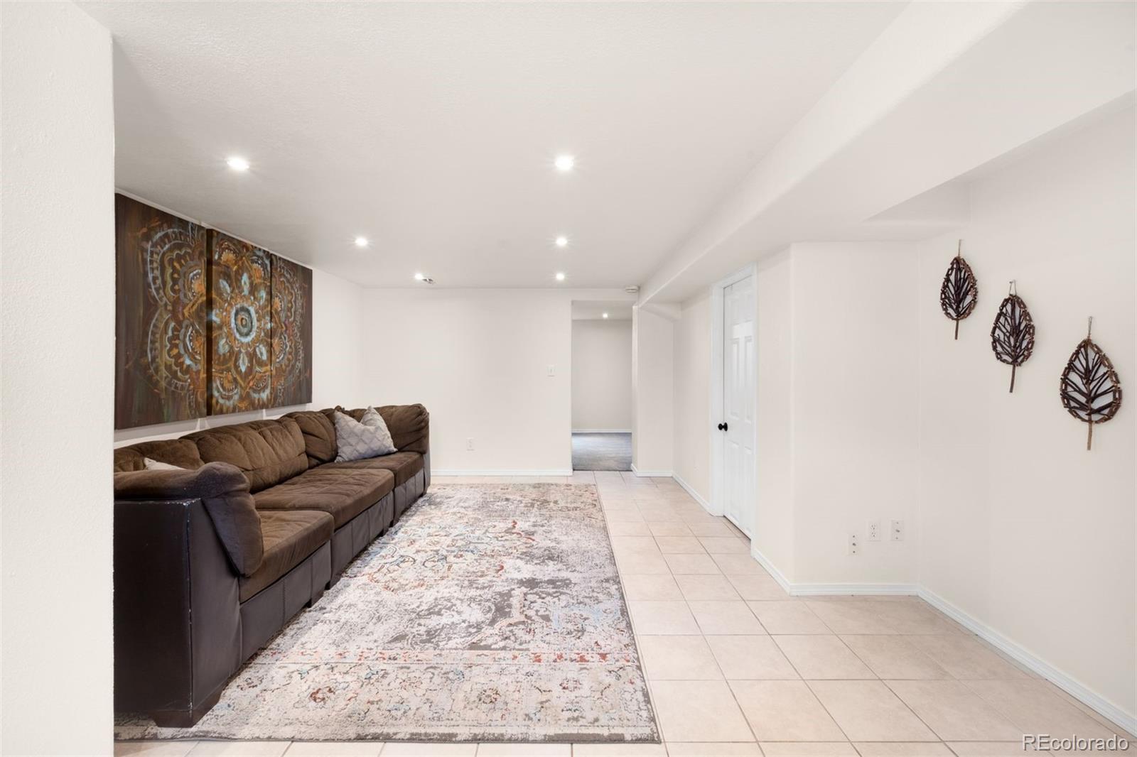 3000 Ivy Street Denver, CO 80207 - Photo 20 of 26 a living room with a couch and a rug