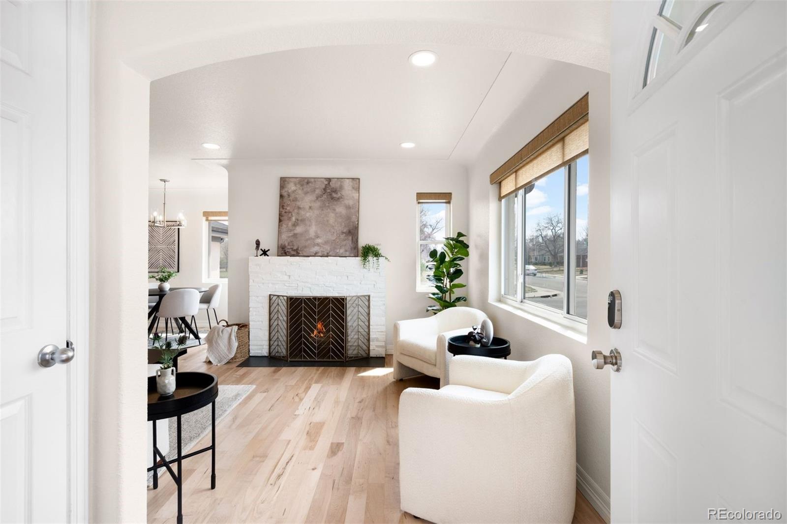 3000 Ivy Street Denver, CO 80207 - Photo 7 of 26 a living room with furniture and a fireplace