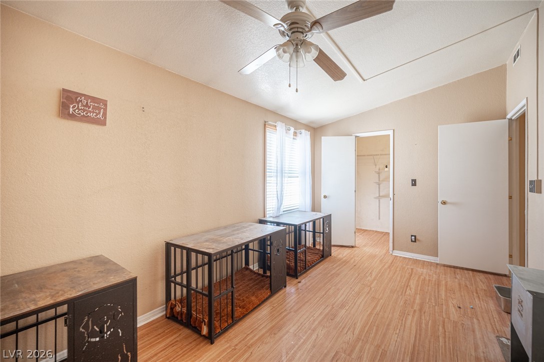 3200 Maple Road Pahrump, NV 89048 - Photo 23 of 53 A versatile room featuring a vaulted ceiling and durable flooring, ideal for a variety of uses.