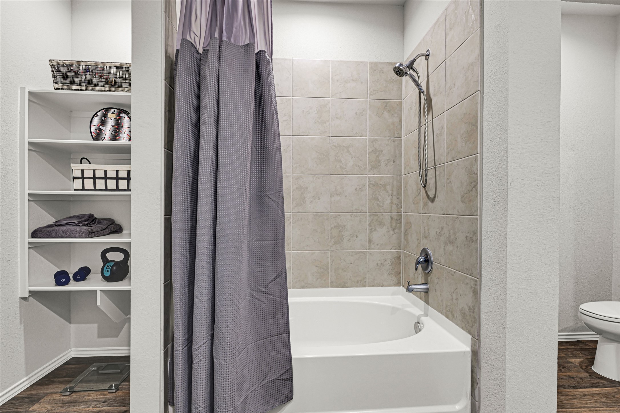 22707 Yarmony Vista Trail Spring, TX 77373 - Photo 16 of 26 a bathroom with a bathtub and shower