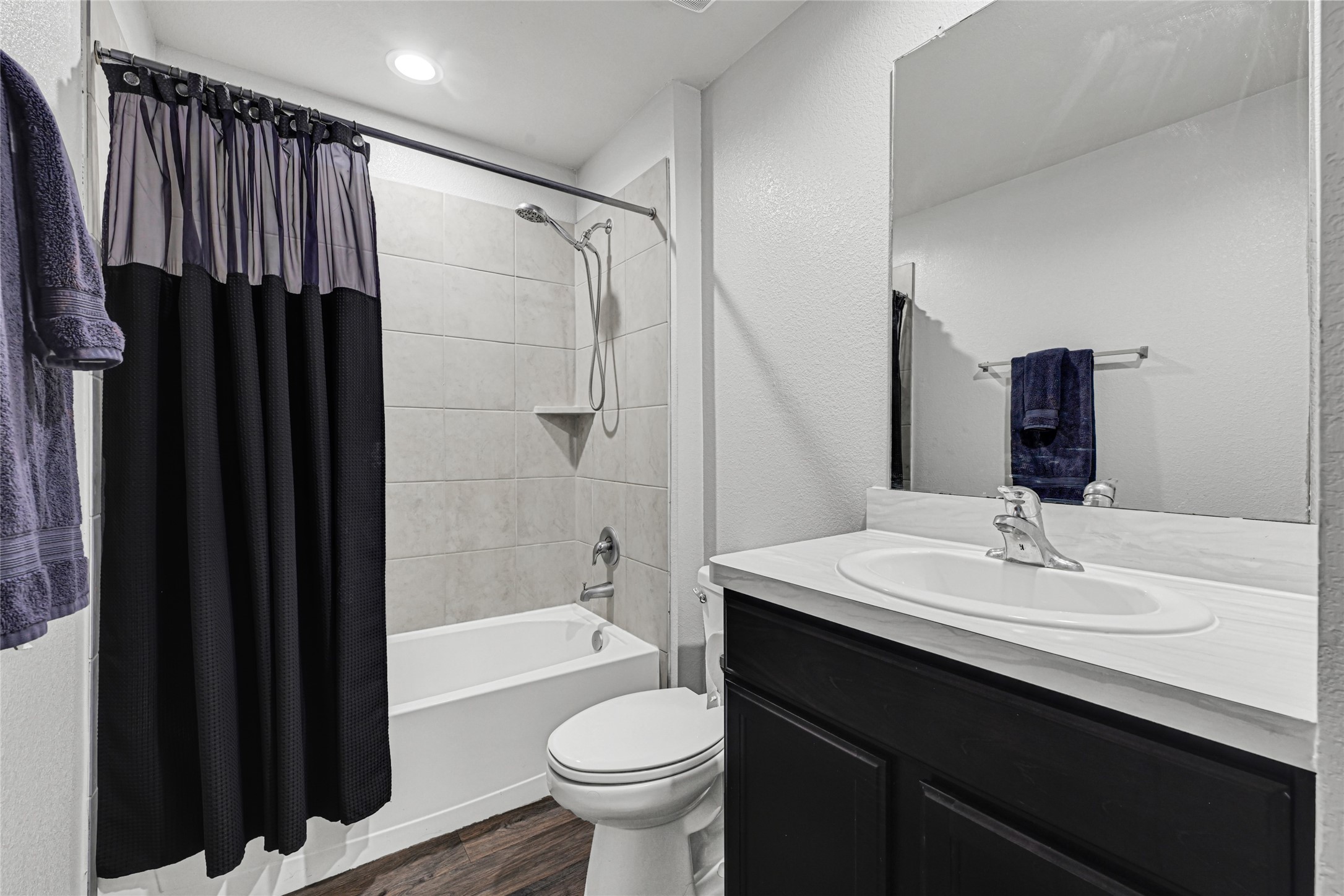22707 Yarmony Vista Trail Spring, TX 77373 - Photo 24 of 26 a bathroom with a sink vanity mirror and toilet