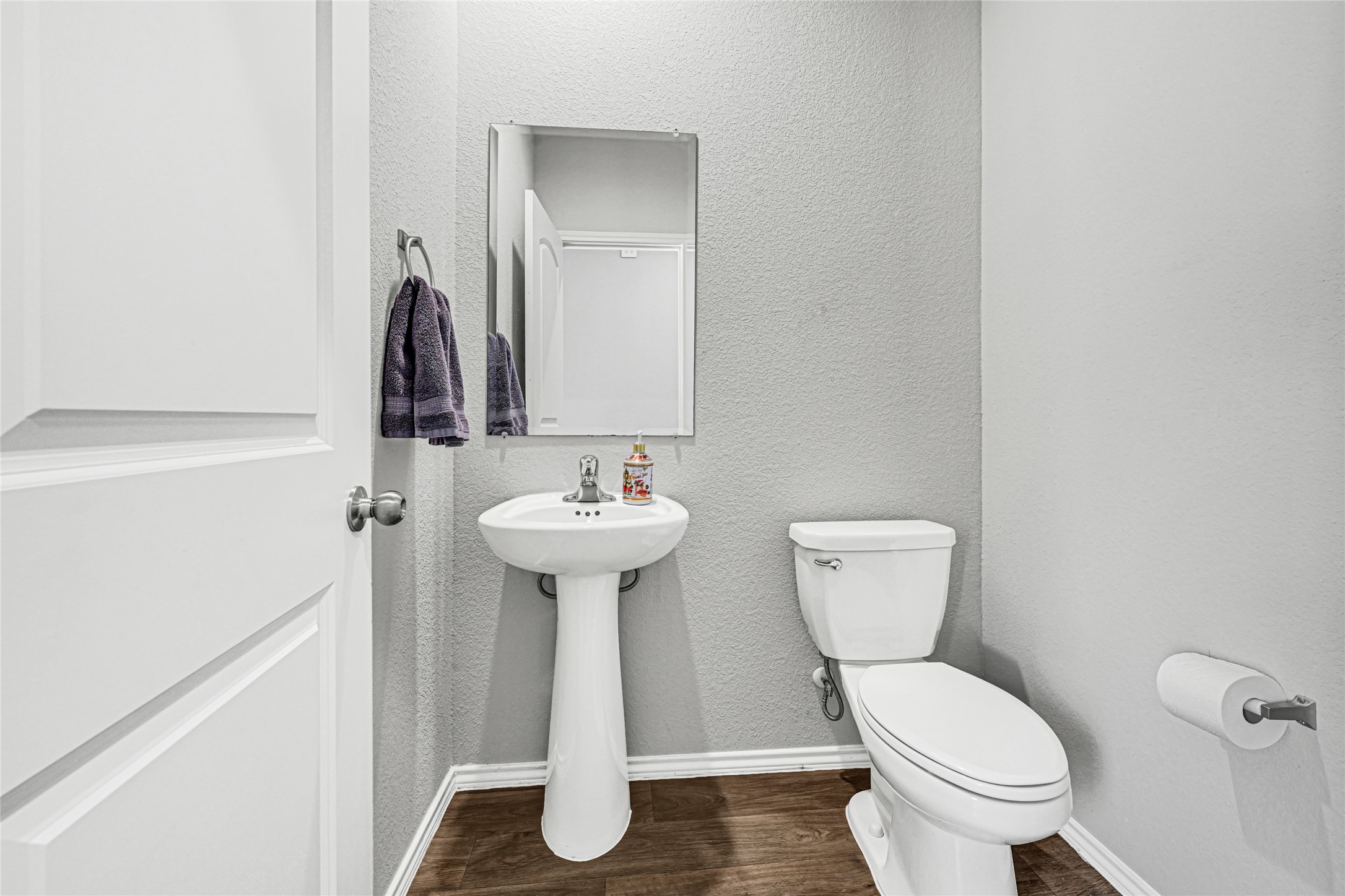 22707 Yarmony Vista Trail Spring, TX 77373 - Photo 9 of 26 a bathroom with a toilet sink and mirror