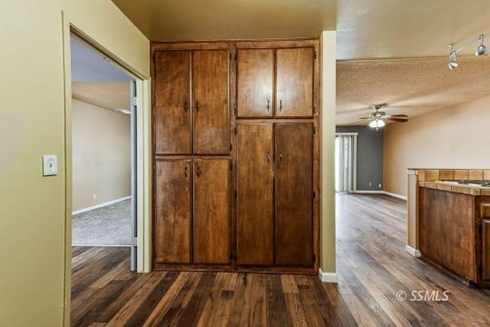 543 South Fairview Street Ridgecrest, CA 93555 - Photo 9 of 38 a view of hallway with wooden floor