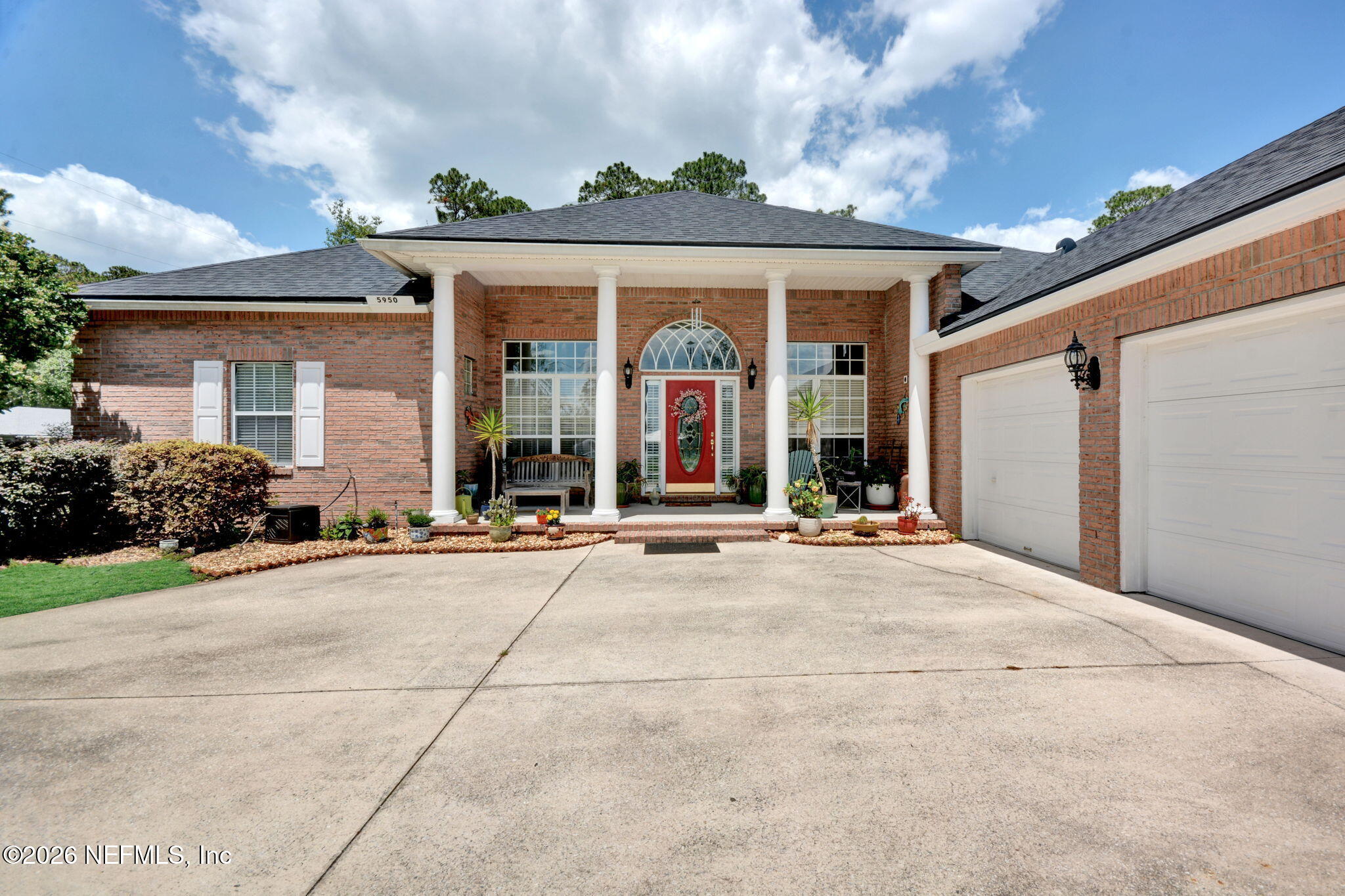 5950 West Shores Road Orange Park, FL 32003 - Photo 42 of 42 a view of a brick house with a large windows