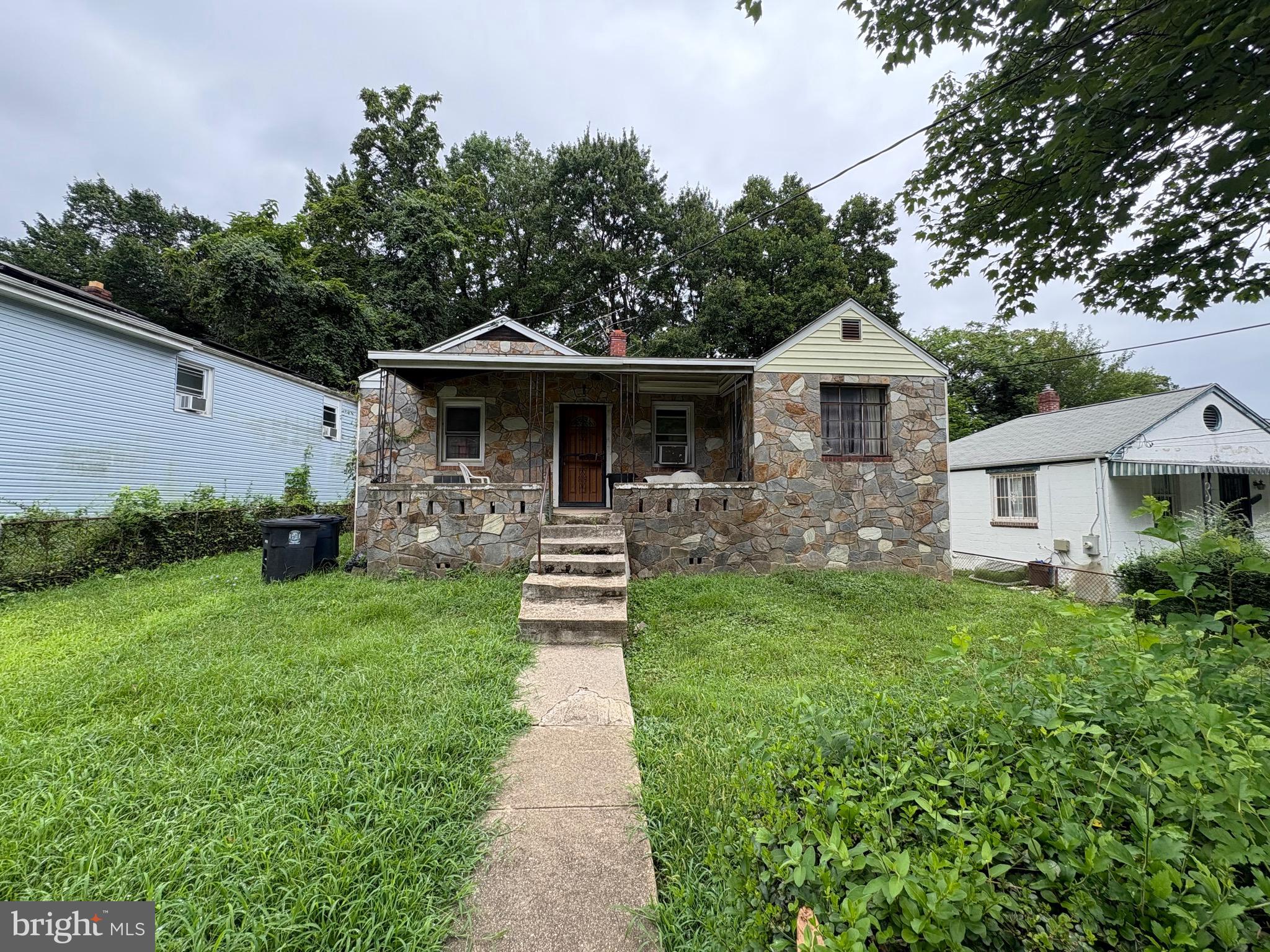 1314 Farmingdale Avenue Capitol Heights, MD 20743 - Photo 1 of 1 a front view of a house with yard and green space