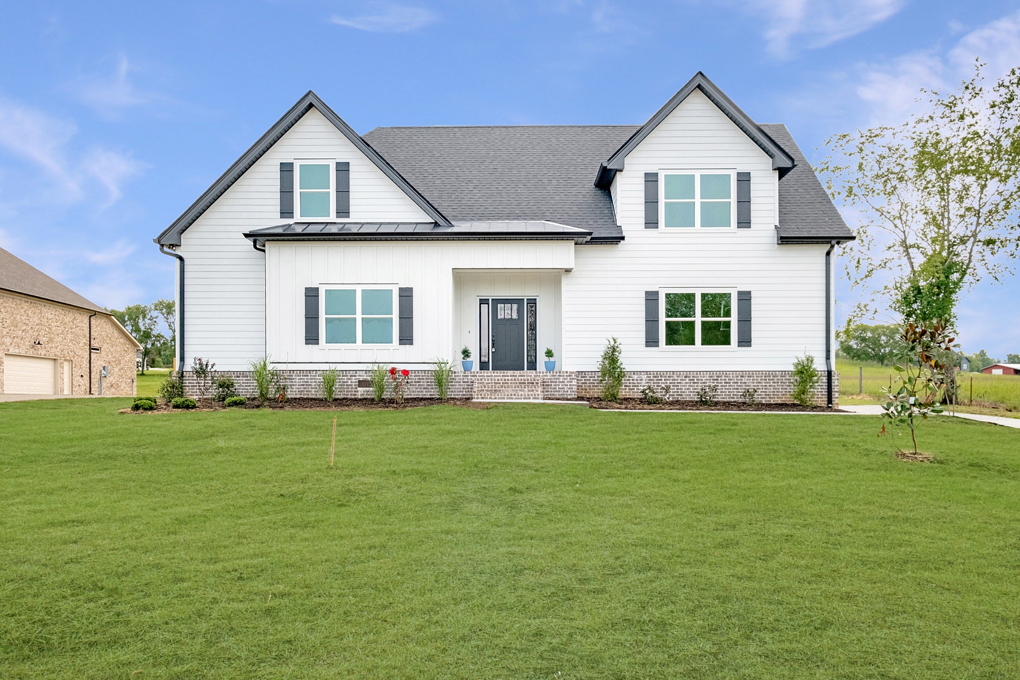 a front view of a house with a yard