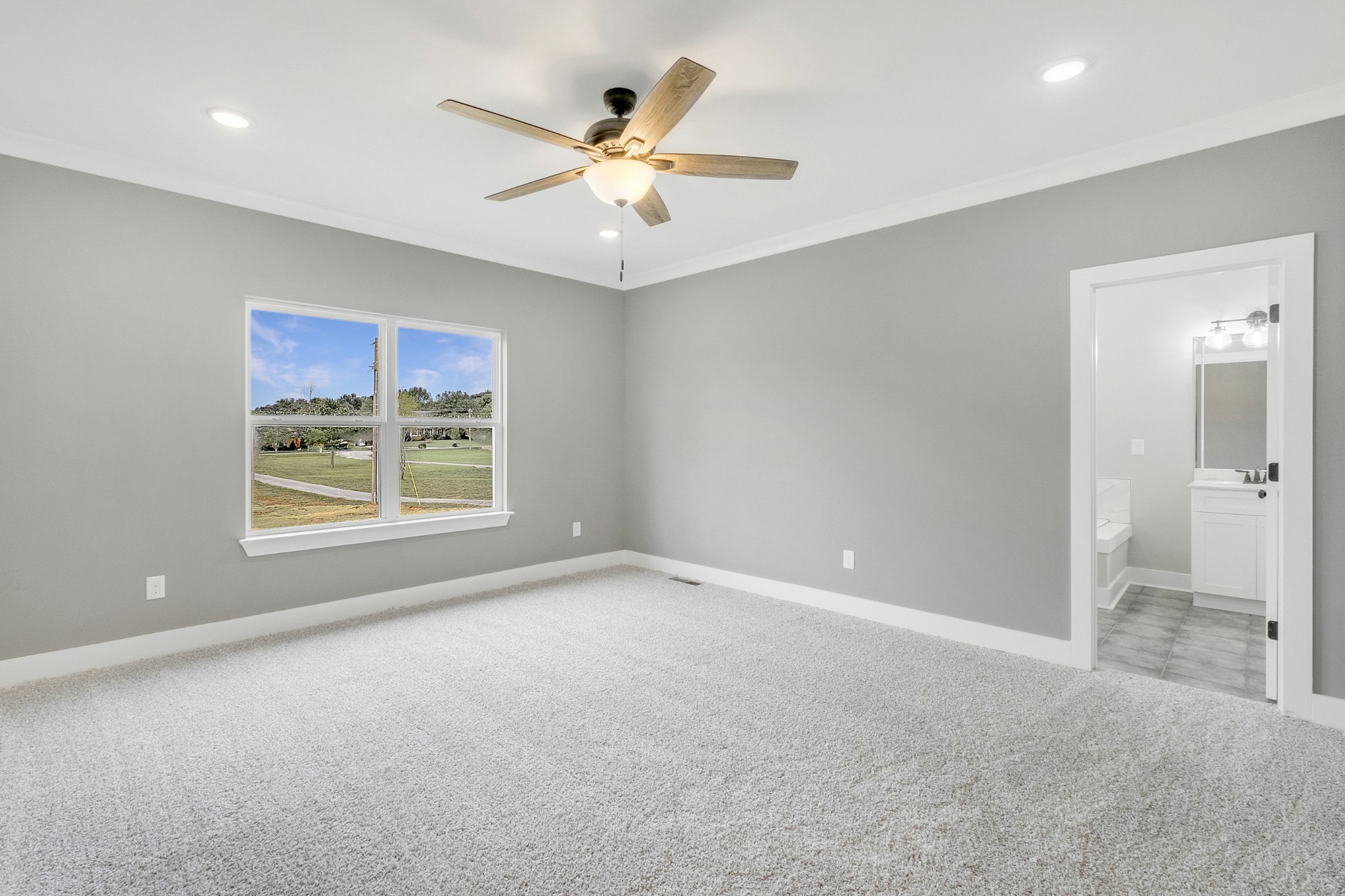 1227 Maple Hill Road Lebanon, TN 37087 - Photo 17 of 43 an empty room with windows and fan