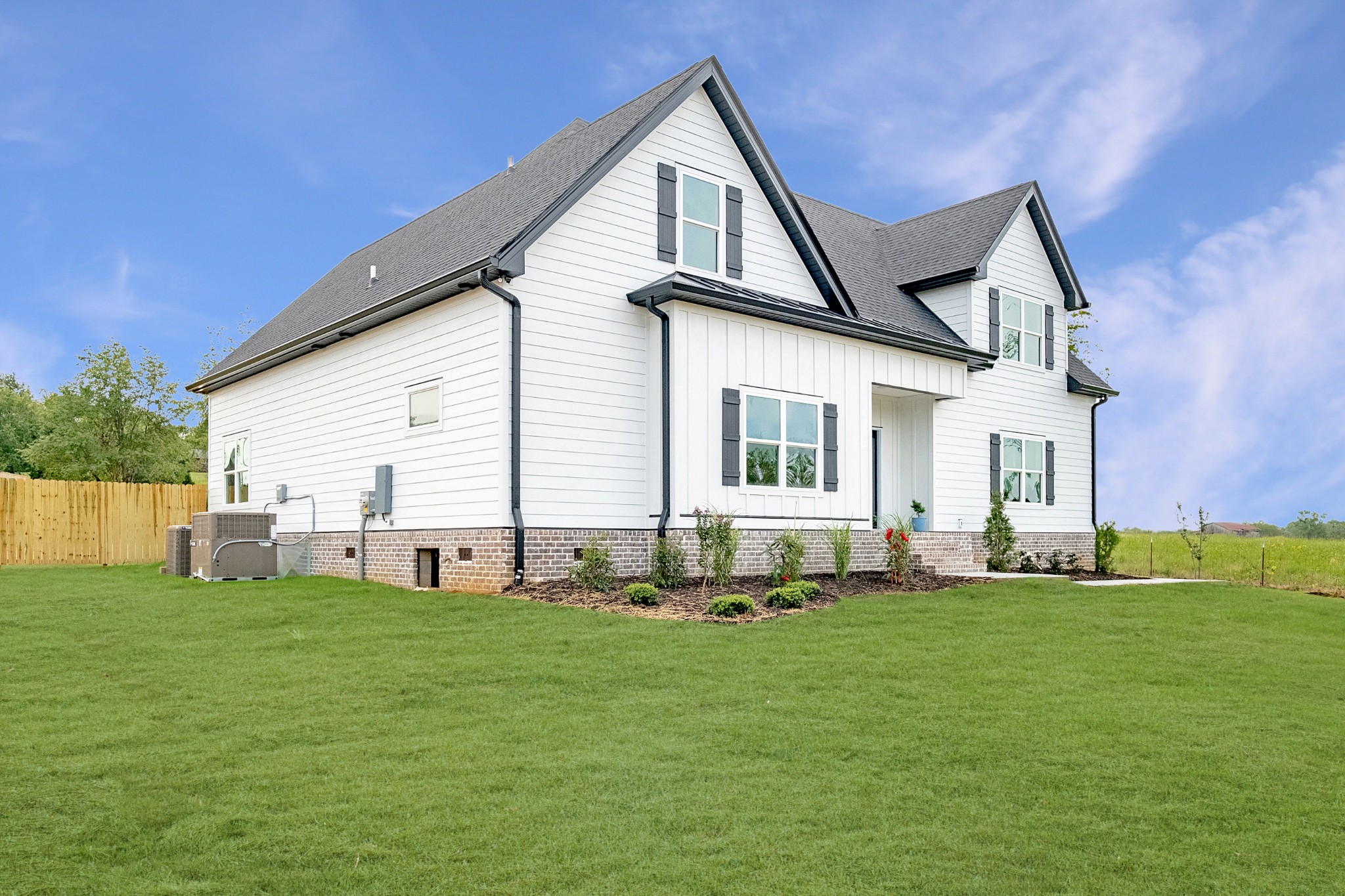 1227 Maple Hill Road Lebanon, TN 37087 - Photo 2 of 43 a front view of a house with a yard and garage