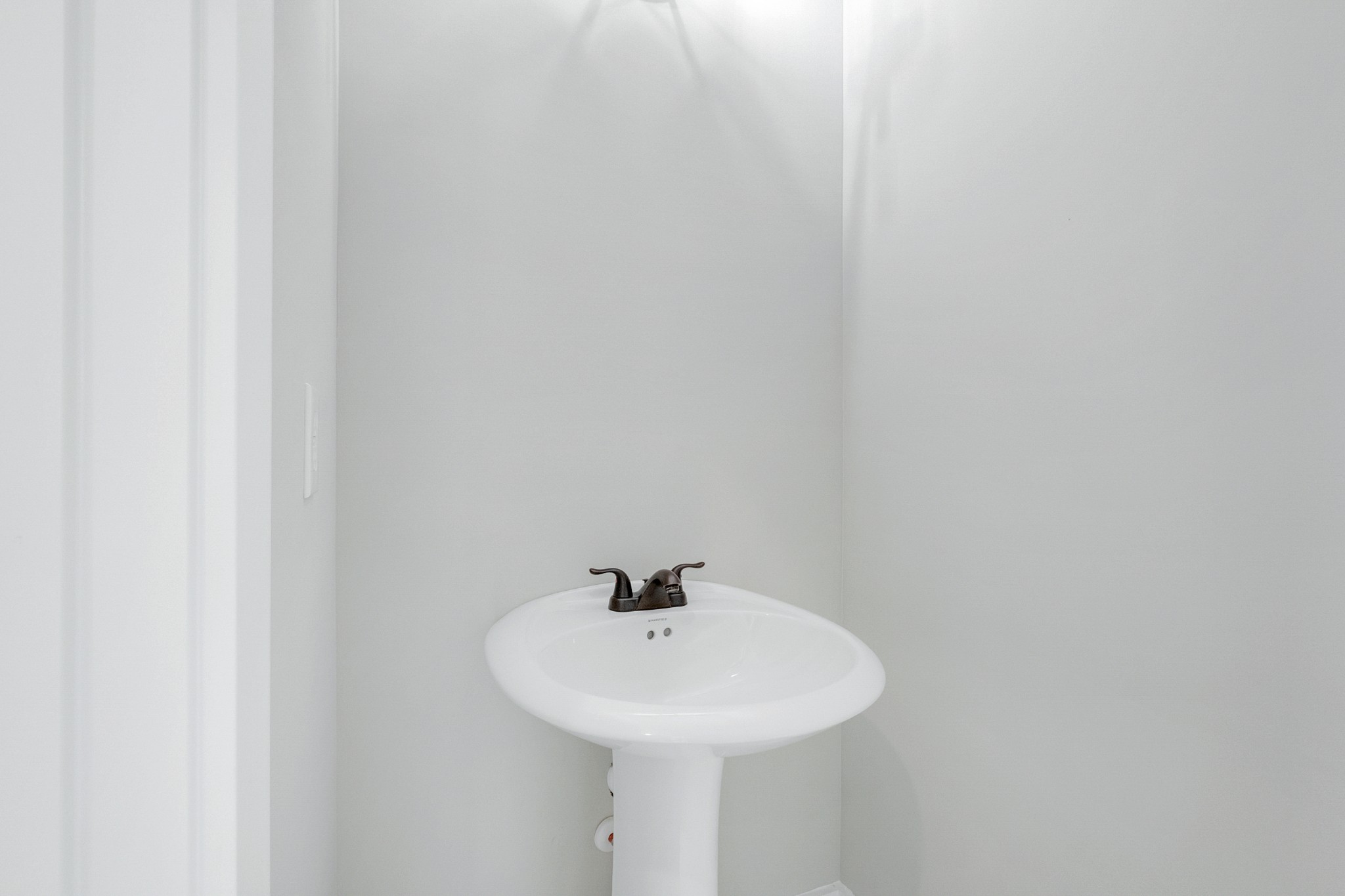 1227 Maple Hill Road Lebanon, TN 37087 - Photo 27 of 43 a white sink sitting under a bathroom mirror
