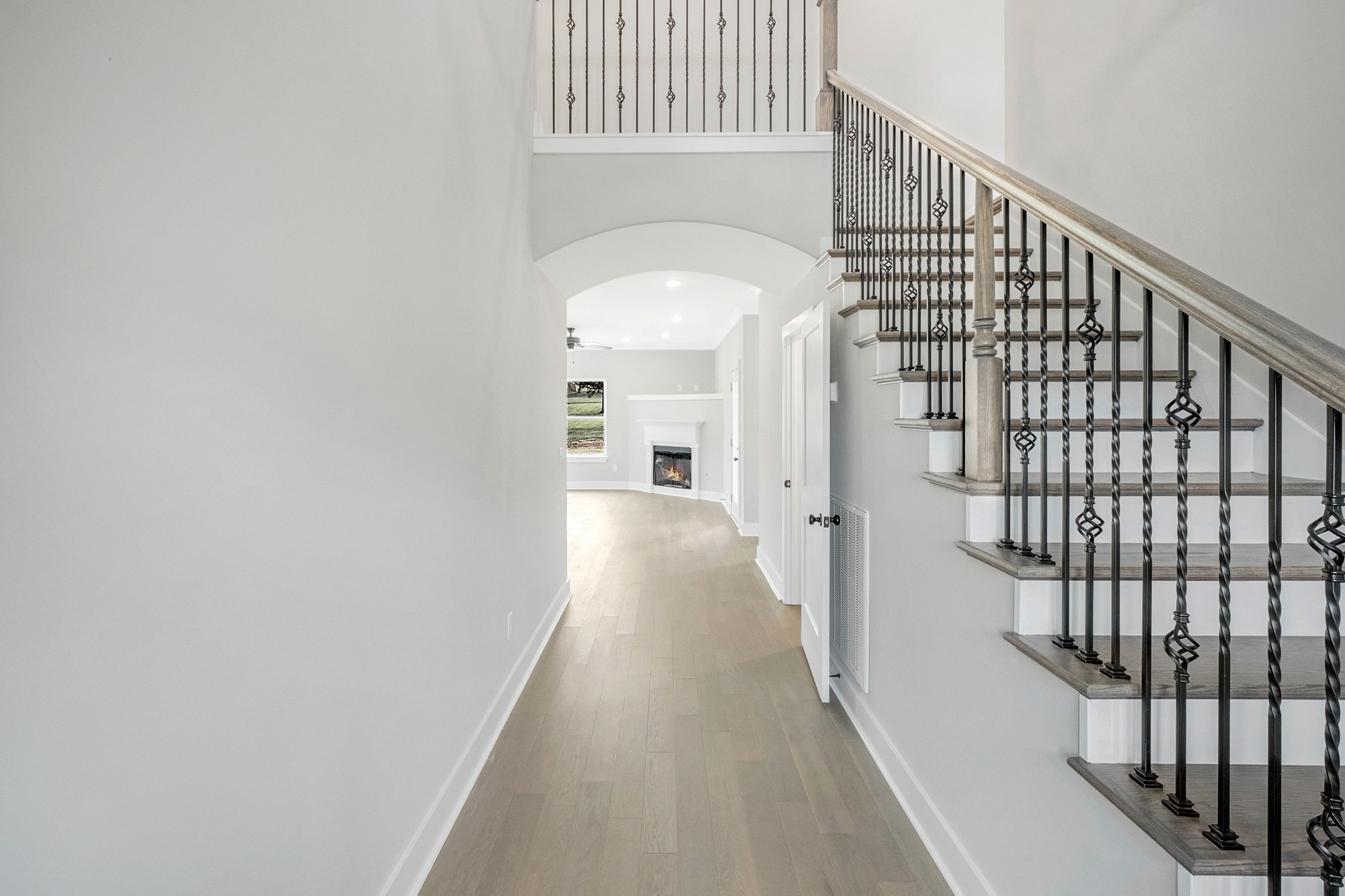 1227 Maple Hill Road Lebanon, TN 37087 - Photo 7 of 43 a view of a hallway with a white walls and stairs